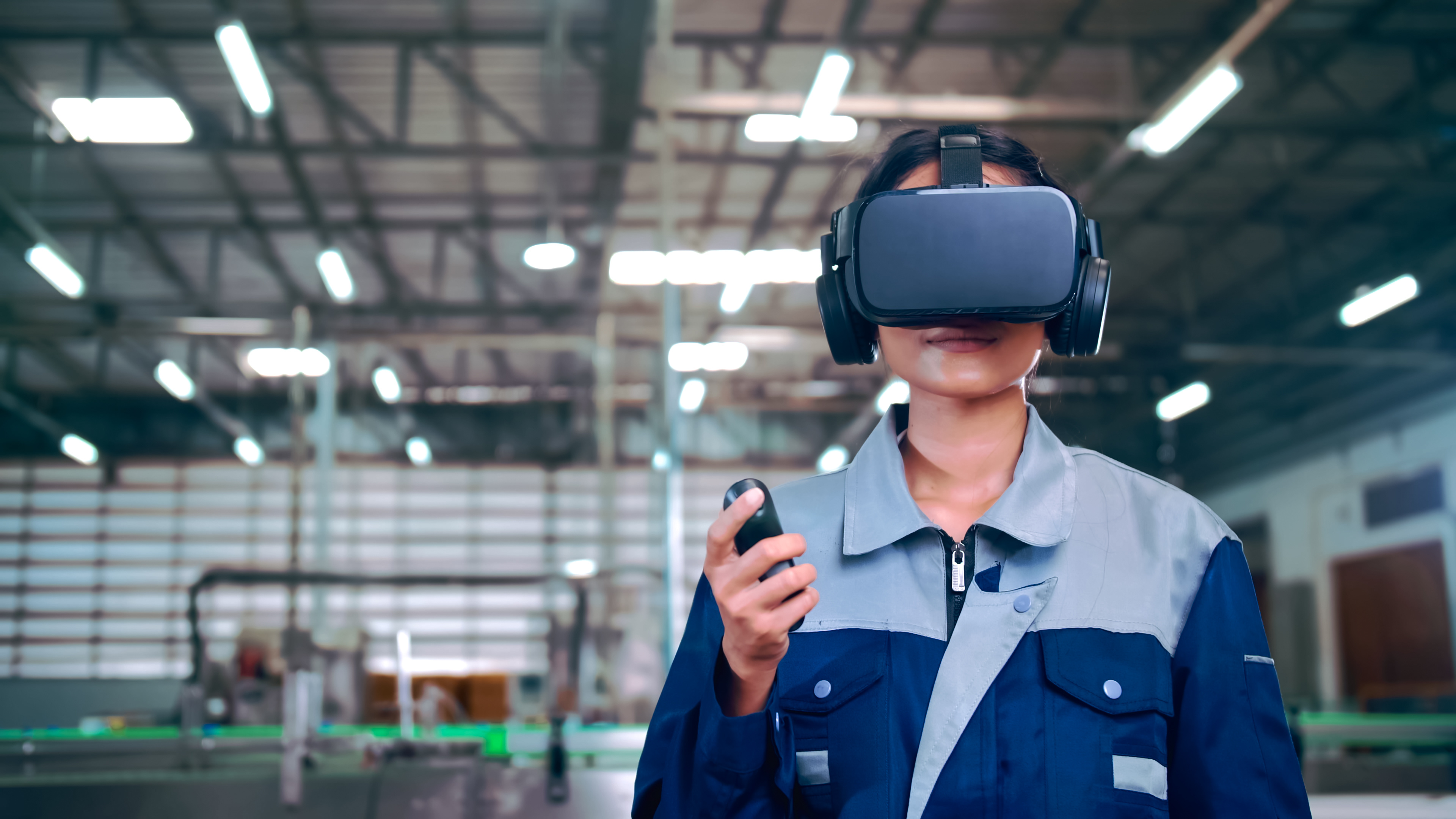 Engineer is using virtual reality glasses to inspect the factory